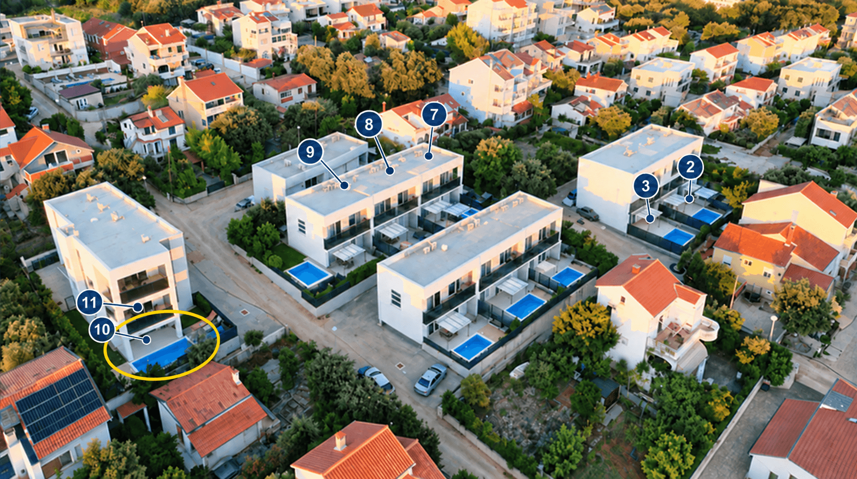 Aerial view with apartment 10 highlighted in yellow and all apartment numbers visible