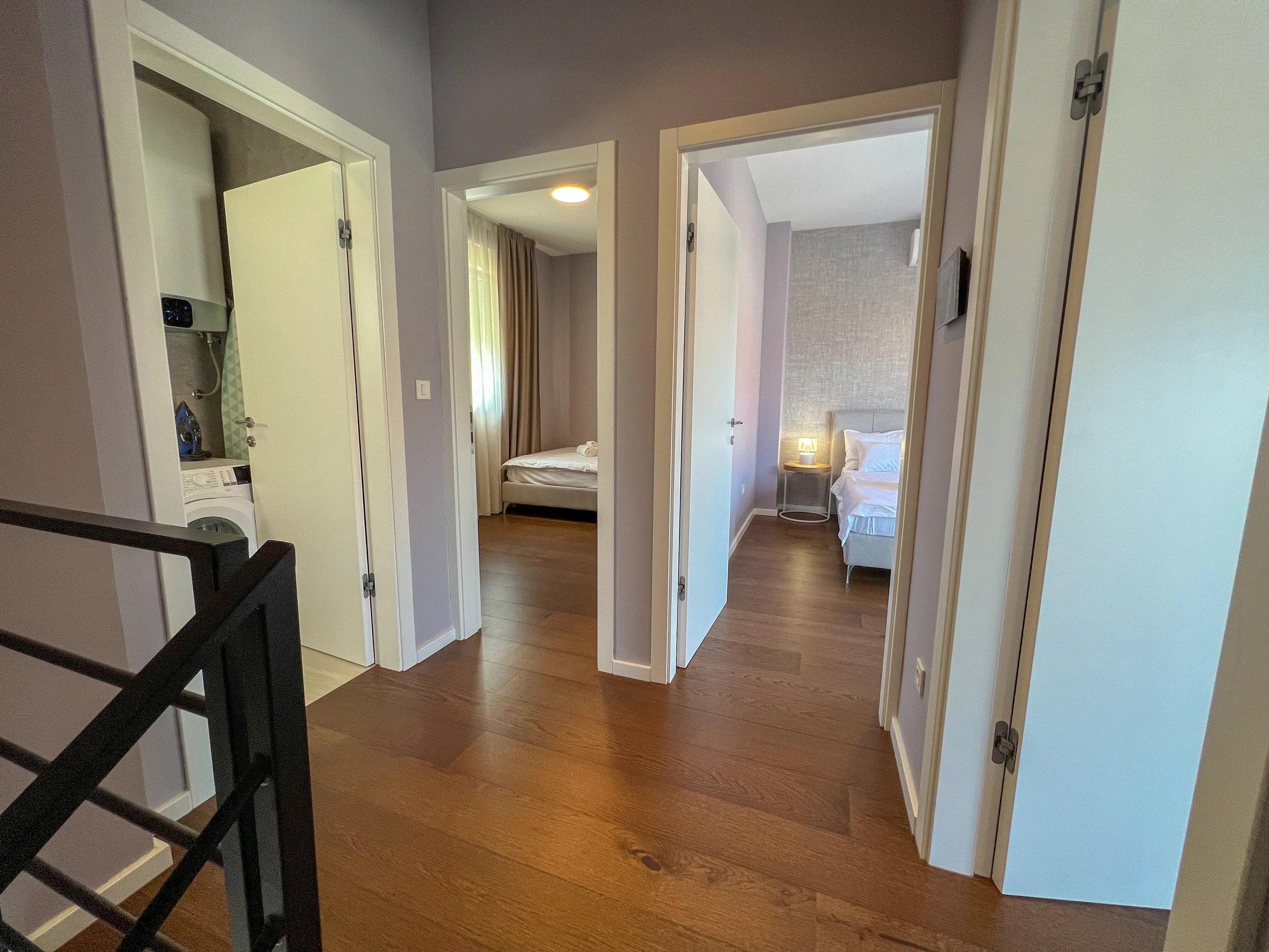 Upper-floor bedroom hallway at Three-Bedroom Premium Apartment Near the Sea