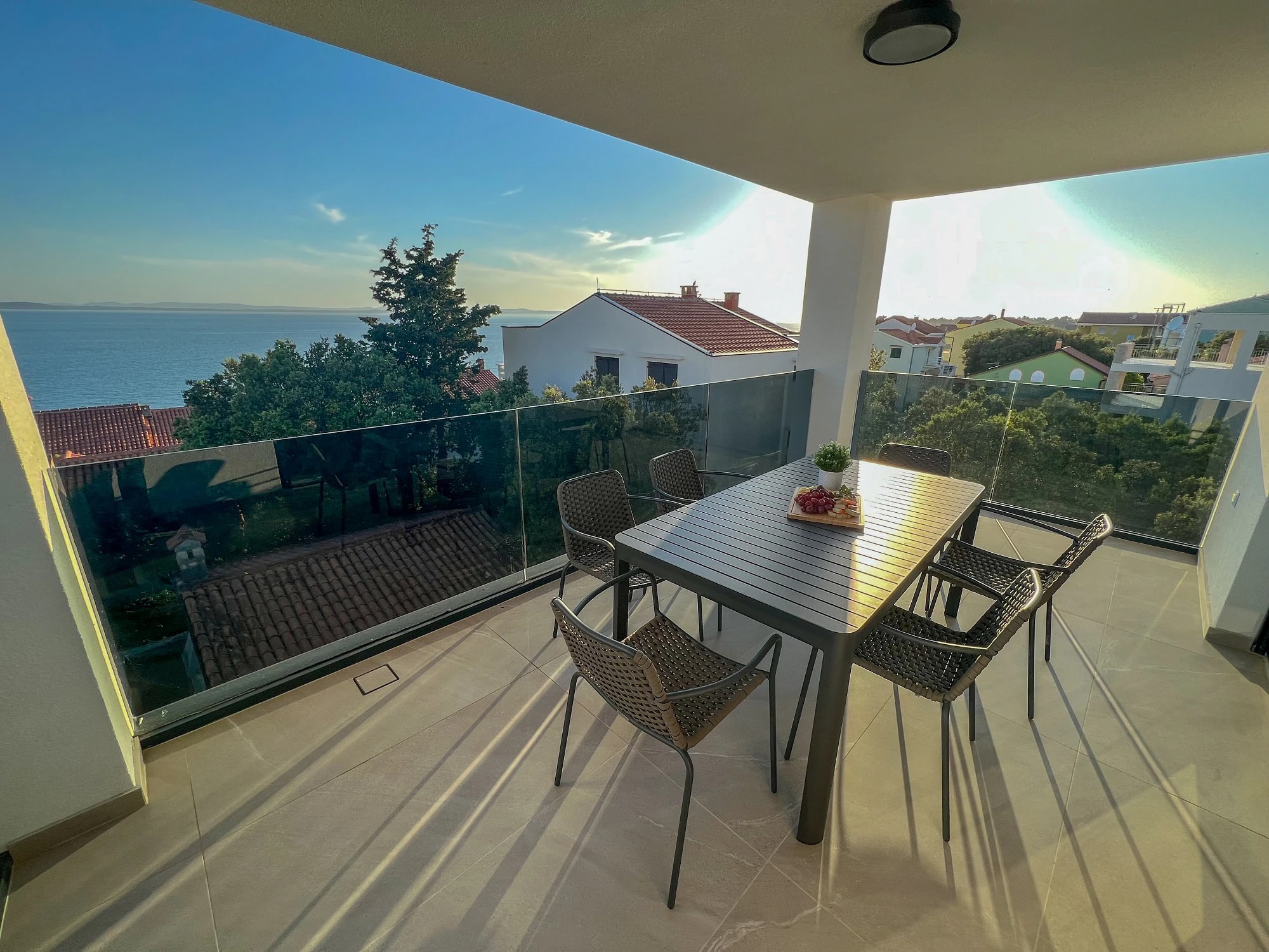 Covered balcony overlooking the Adriatic at Three-Bedroom Apartment Near the Sea