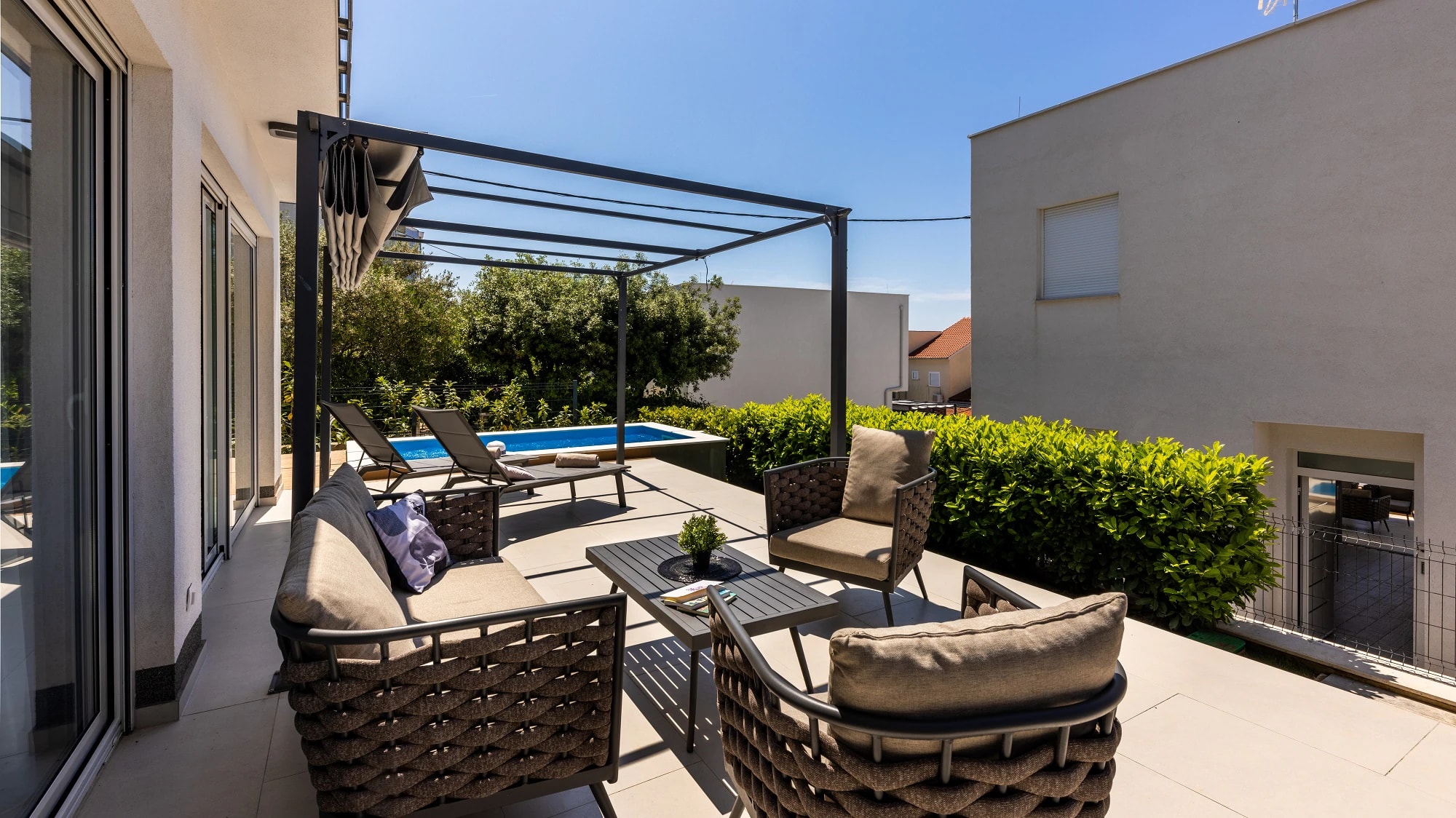 Outdoor lounge and private pool at Three-Bedroom Apartment with Private Pool Near the Sea