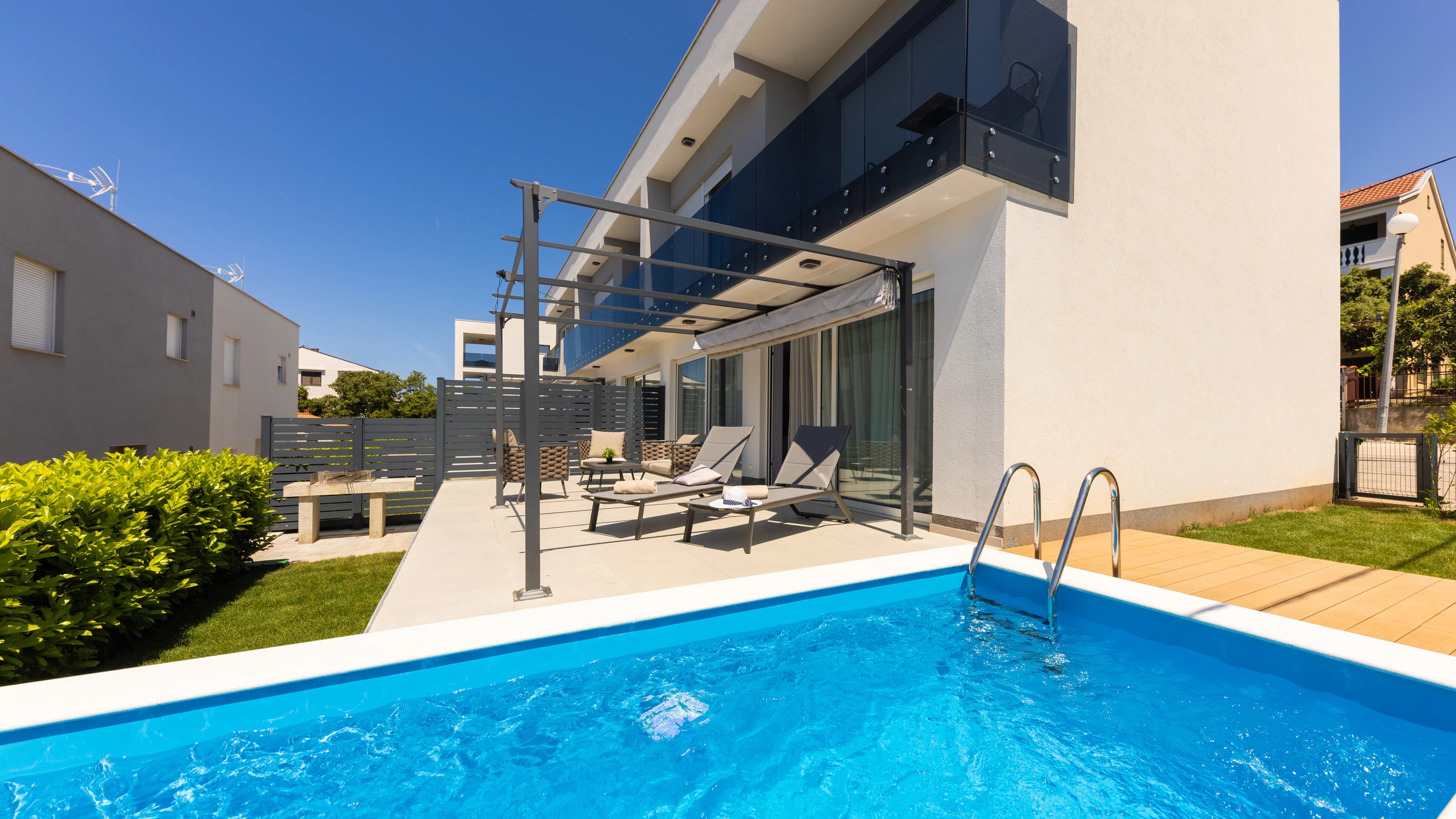 Private pool beside the modern apartment at Three-Bedroom Apartment with Private Pool Near the Sea