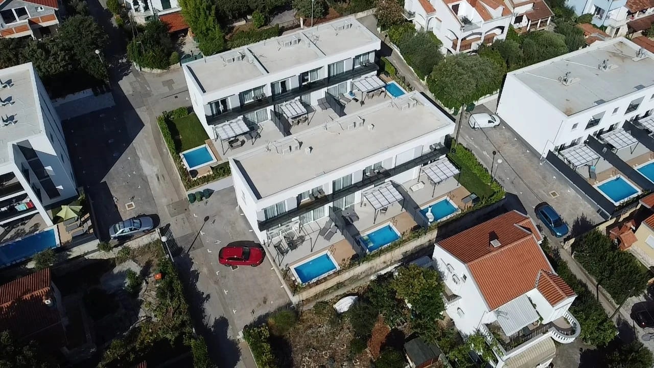 Aerial view of the private pools at Three-Bedroom Apartment with Private Pool Near the Sea