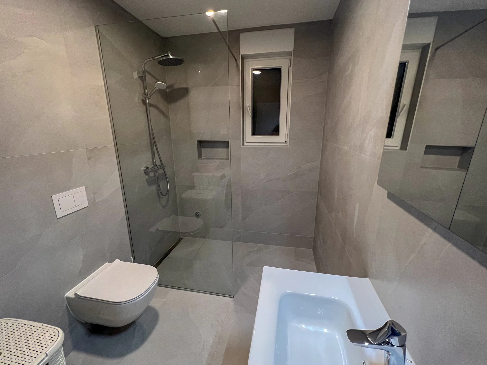 Bathroom with a walk-in shower at Three-Bedroom Apartment with Private Pool Near the Sea