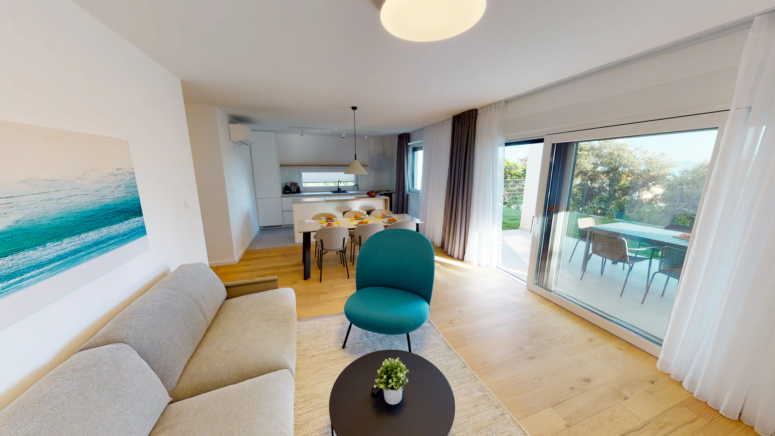 Living area opening onto the terrace at Three-Bedroom Apartment with Private Pool Near the Sea