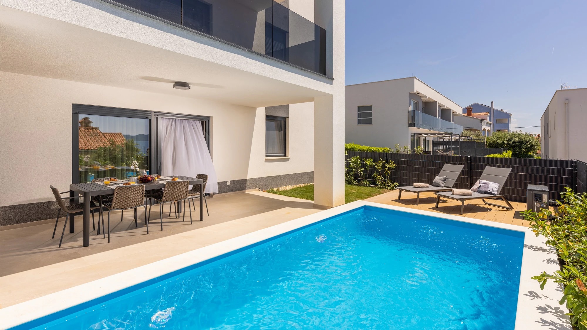 Private pool in front of the apartment at Three-Bedroom Apartment with Private Pool Near the Sea
