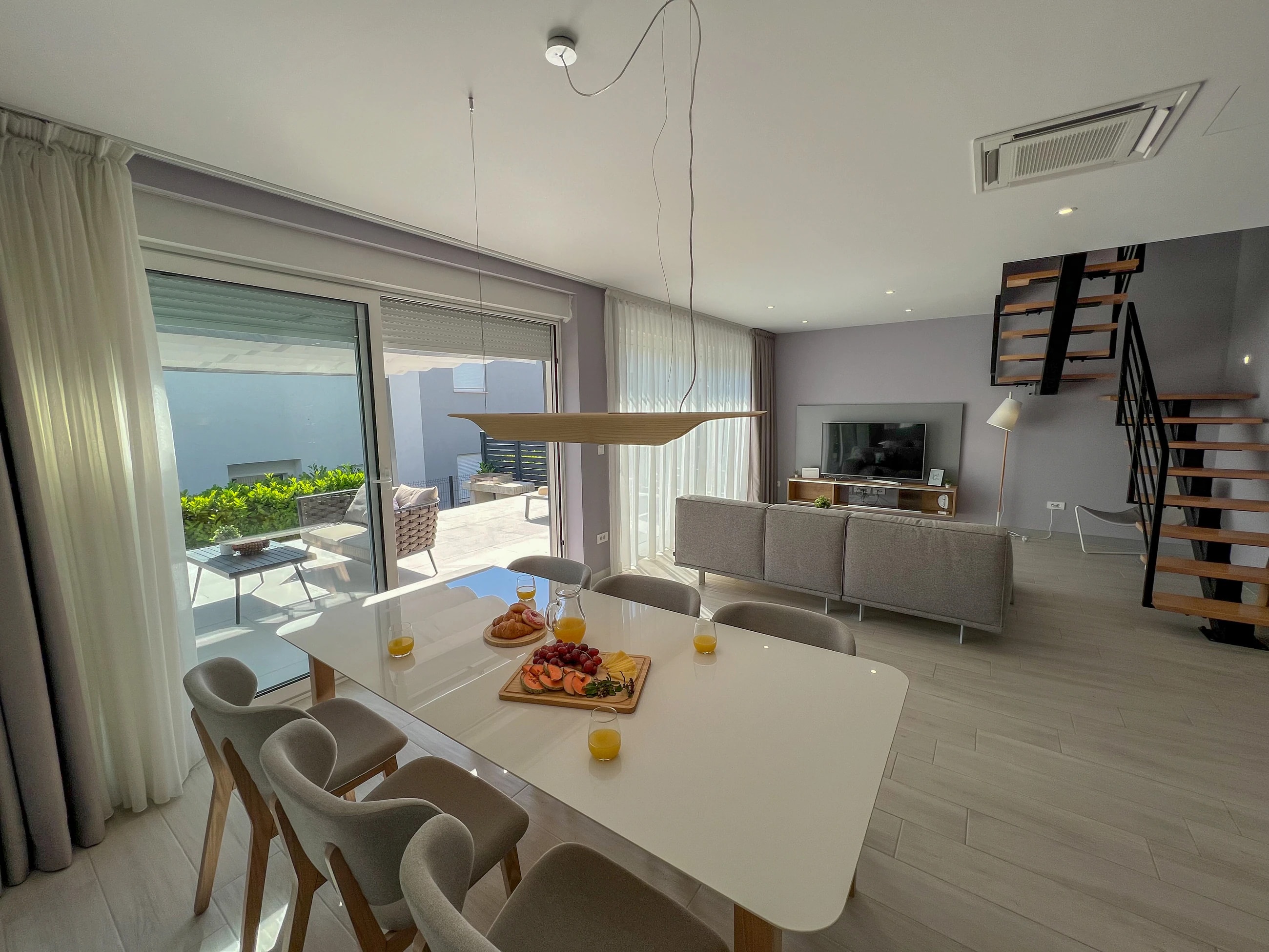 Dining island in the open living space at Three-Bedroom Apartment with Private Pool Near the Sea