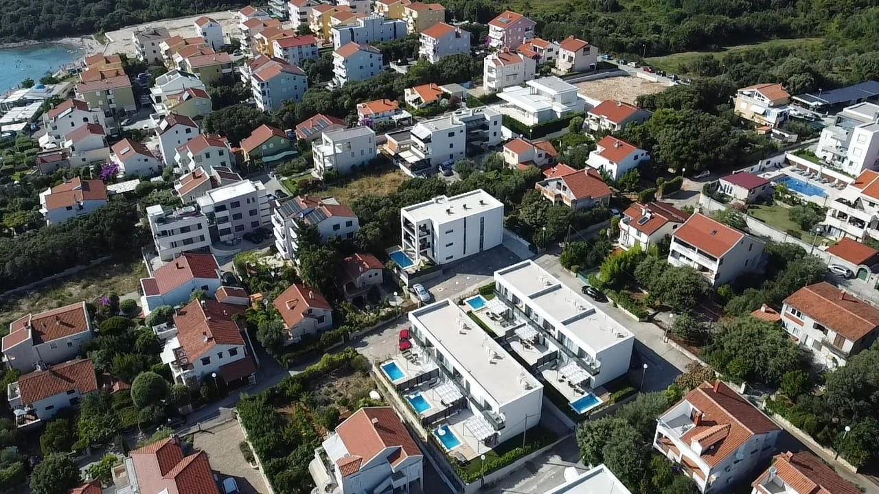 Aerial view of the apartment buildings at Three-Bedroom Apartment with Private Pool Near the Sea
