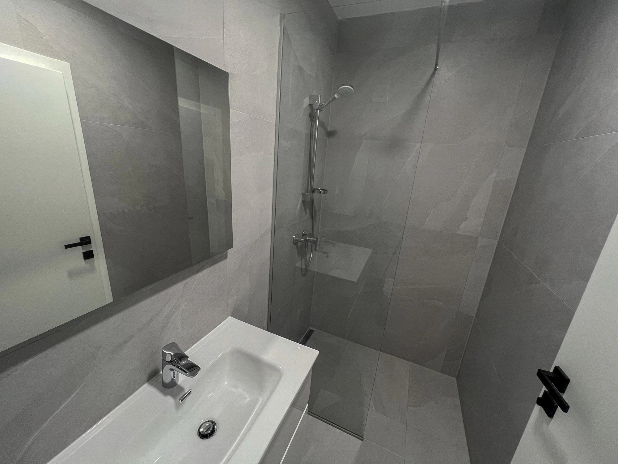 Bathroom with a walk-in shower at Three-Bedroom Apartment with Private Pool Near the Sea