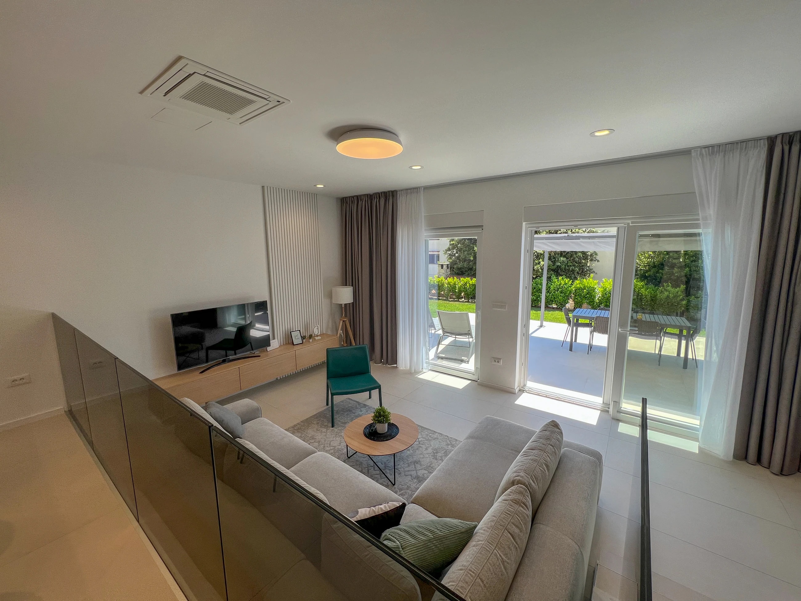 Living room facing the terrace at Three-Bedroom Apartment with Private Pool Near the Sea