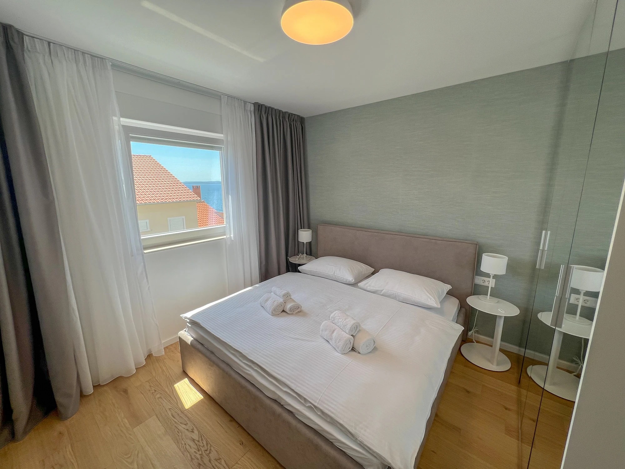 Double bedroom with natural light at Three-Bedroom Apartment with Private Pool Near the Sea