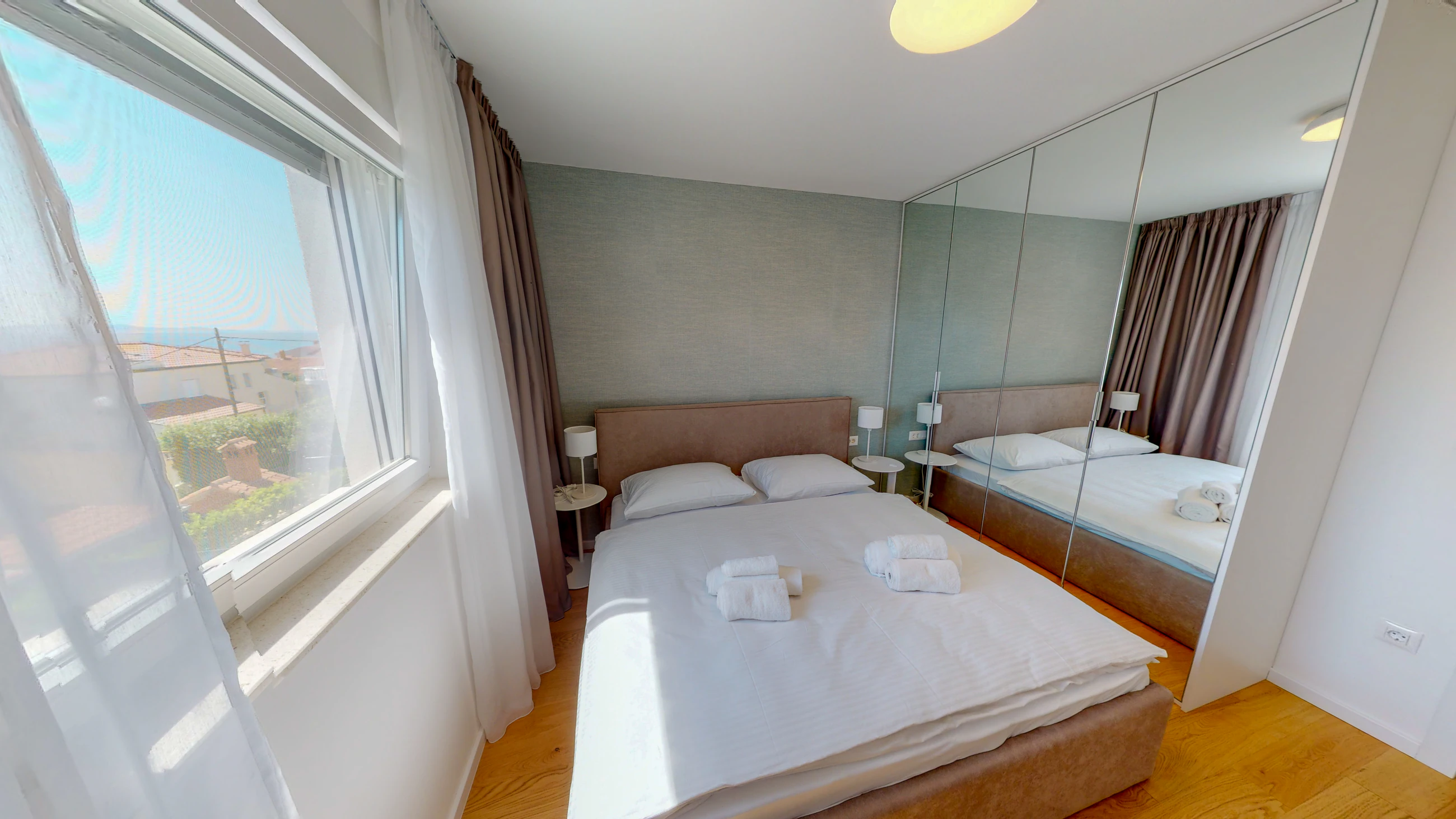Third double bedroom at Three-Bedroom Apartment with Private Pool Near the Sea