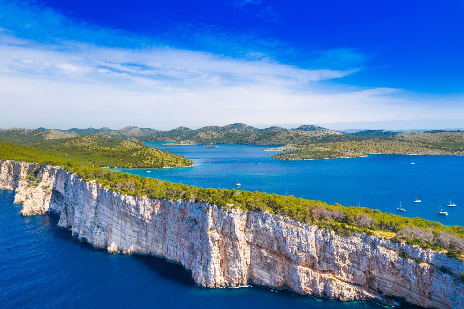 Aerial view of the cliffs, protected bay and islands around Telascica on Dugi Otok