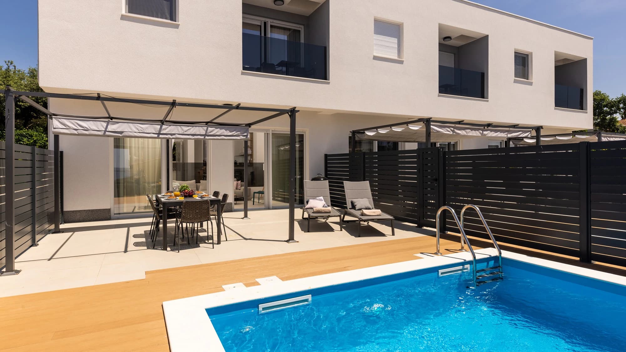Private pool and apartment exterior at Three-Bedroom Apartment with Private Pool Near the Sea