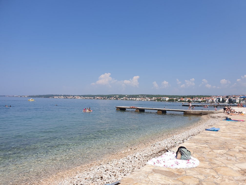 Pebble shoreline and swimming area at Borik Beach