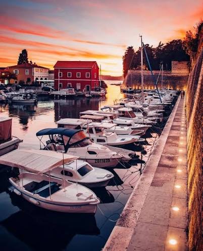 Fosa harbour and Zadar city walls in evening light